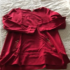 Red tunic with gold zipper accents